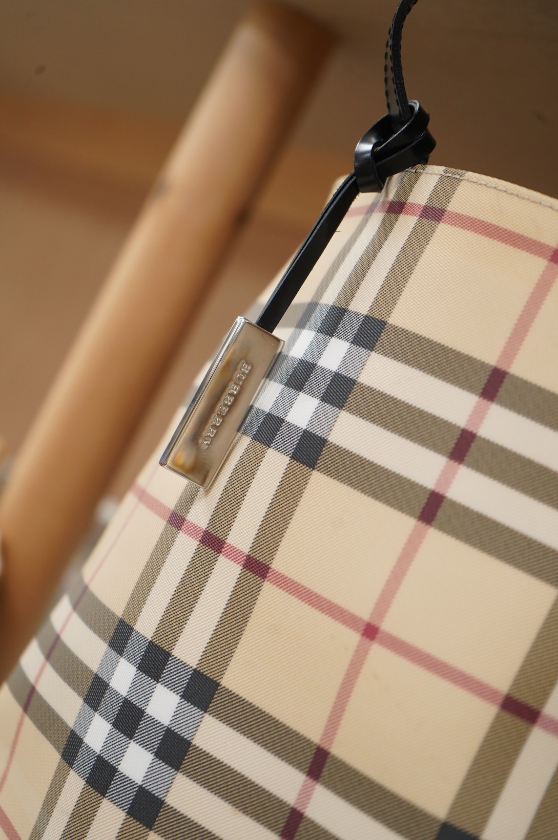 A Burberry handbag with PCV check exterior, 28cm wide